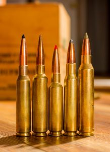 Left to right, the 6.5x55 Swede, 6.5-284 Norma, 6.5 Creedmoor, 7x57 Mauser, and 7mm Rem Mag, all cartridges with metric designation names.
