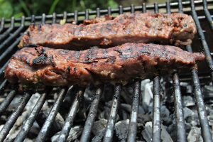 Grill the marinated backstrap over hot coals or on a gas grill turned to high for four to five minutes per side for medium-rare. Remove the backstrap to a warm platter and tent with foil to rest.