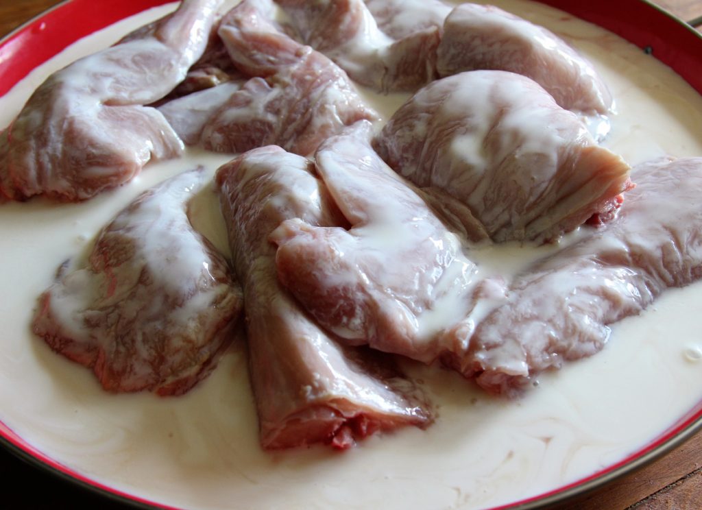 Marinating the rabbit in buttermilk for two to eight hours helps to tenderize the meat and add flavor and moisture to the finished product.