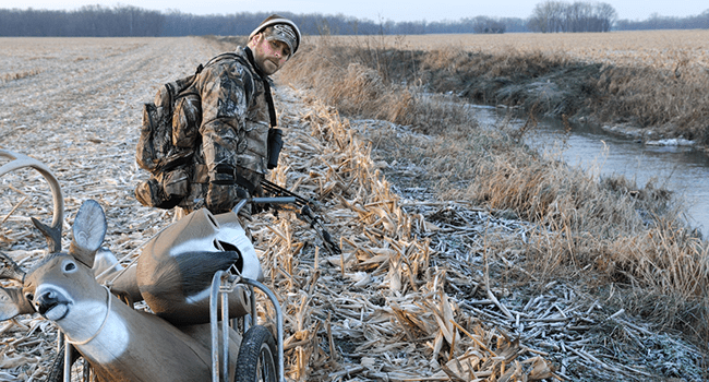 Male hunter carting a decoy