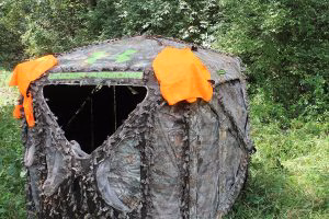 If your blind doesn’t come with blaze orange panels, something as simple as hanging hunter-orange vests from each corner will alert other hunters in the area to your location.