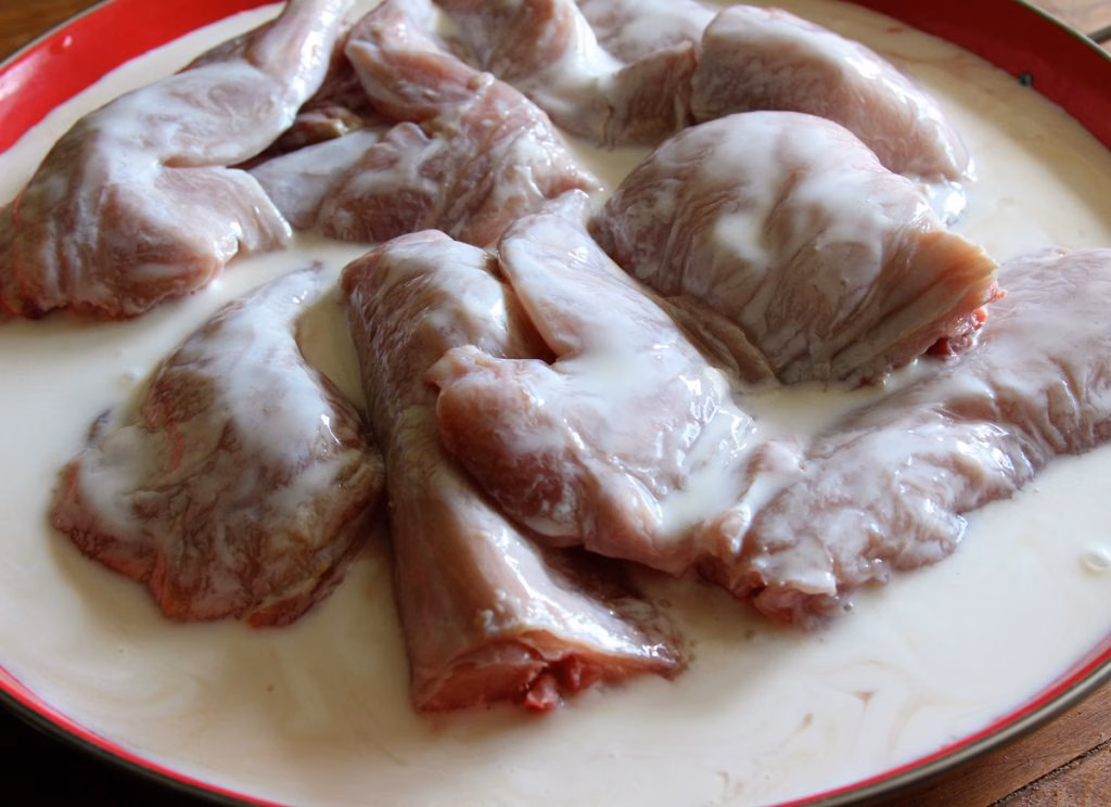 Marinating the rabbit in buttermilk for two to eight hours helps to tenderize the meat and add flavor and moisture to the finished product.