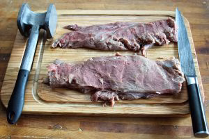 Slice or pound the backstrap to a roughly 1” thickness so the interior gets finished in the short time it takes to sear the surface of the meat over hot coals.