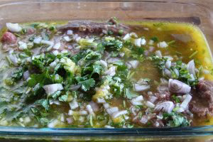 Place the flattened backstrap into a glass or other non-reactive dish and pour the marinade over the top. Flip the backstrap a few times to cover it well with marinade.