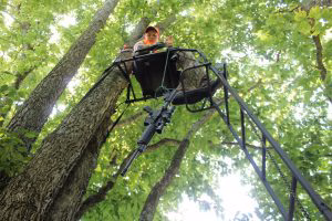 Always raise or lower guns, bows or packs with a pull rope—and never climb into or out of a stand with a loaded firearm. Raise and lower firearms with the muzzle pointed downward and the chamber open.